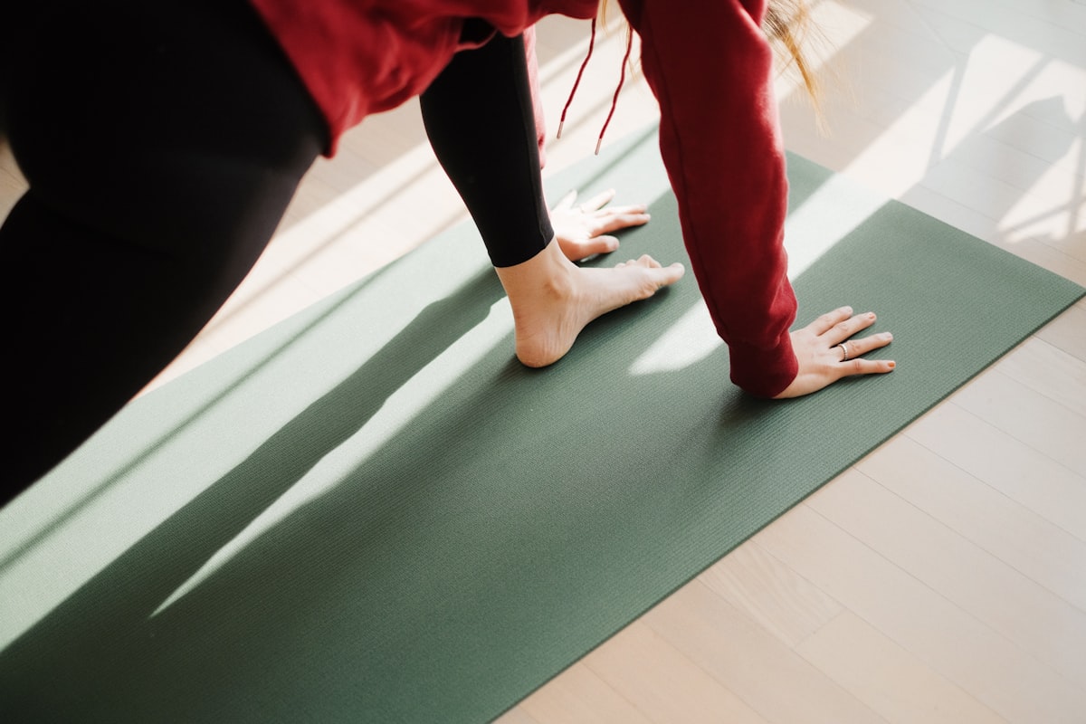 Person practicing yoga for back health